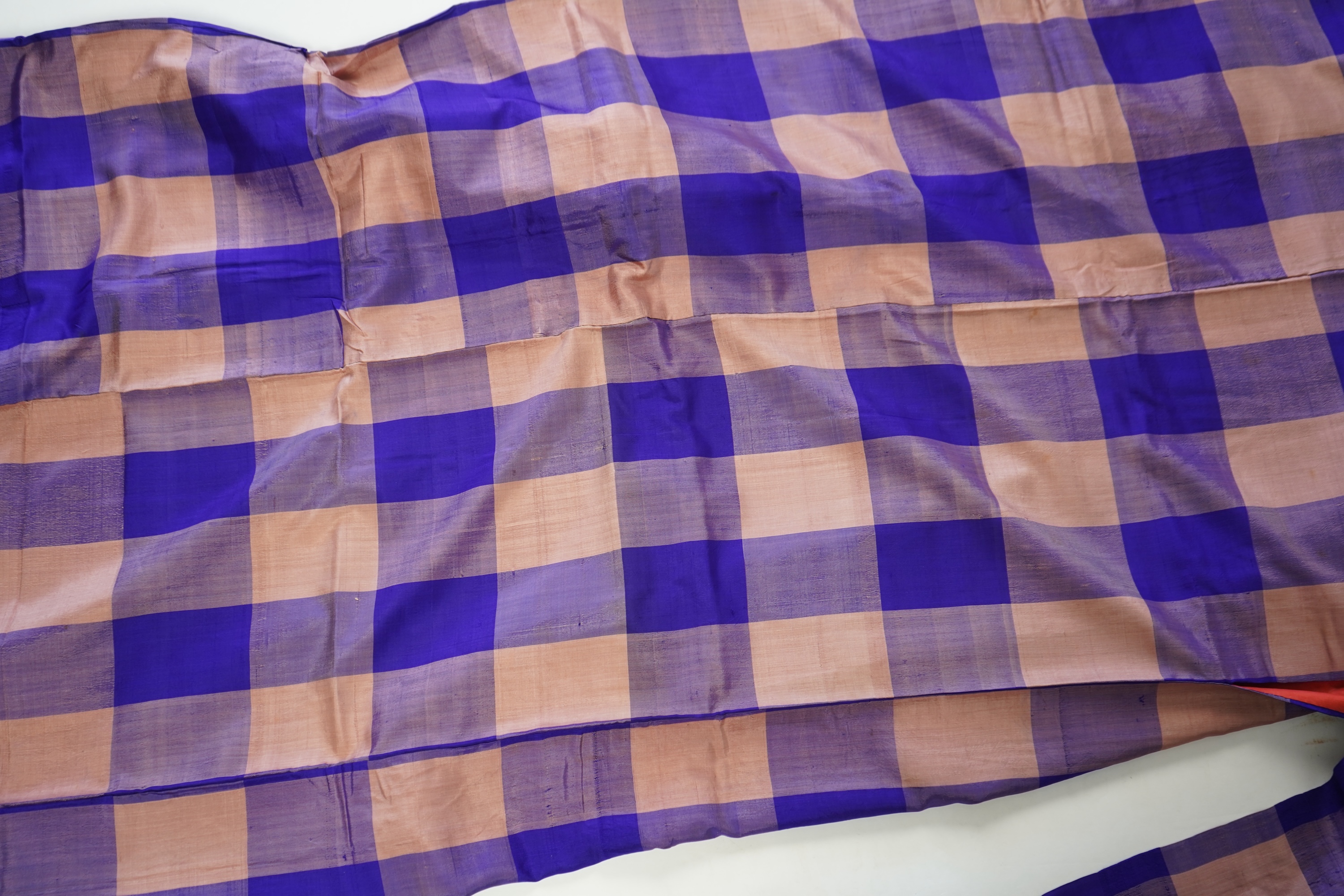Four 1930’s - 1950’s printed silk full length silk lined Japanese kimonos. Two floral and two geometric in design. Longest black and orange floral designed kimono, 150cm long. Condition - purple and pink check kimono the